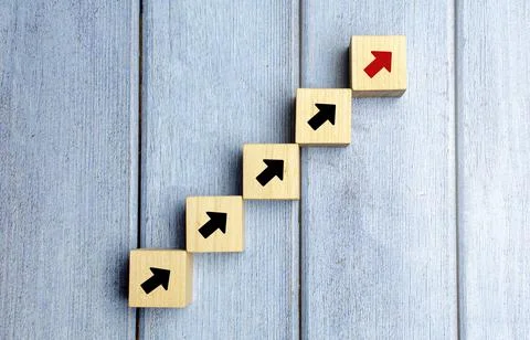 Wooden blocks stacking as step stair with arrow up, Business growth success p Stock Photos