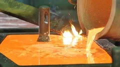Liquid gold is poured into molds, Stock Video