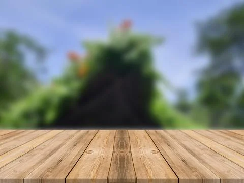 WOODEN BOARD EMPTY TABLE IN FRONT OF BLURRED FLOWER BACKGROUND Illustrazione stock