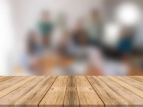 WOODEN BOARD EMPTY TABLE IN FRONT OF BLURRED OFFICE BACKGROUND Illustrazione stock