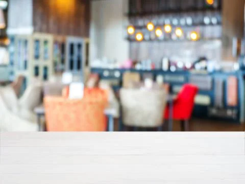 Wooden board empty table in front of blurred cafe 스톡 사진
