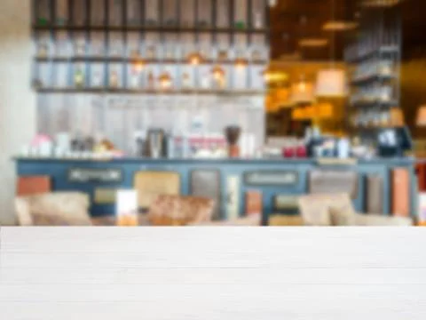 Wooden board empty table in front of blurred cafe 스톡 사진