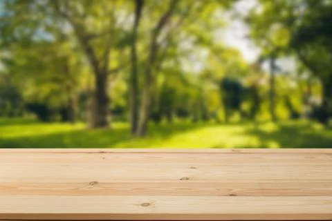Wooden board empty table in front of a blurred background. Perspective brown  Stock Photos