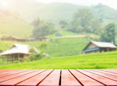 Wooden board empty table in front of blurred background. Stock Photos