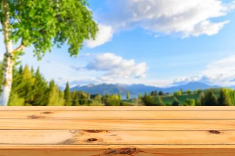 Wooden board empty table top blur mountain landscape background Stockfoto's