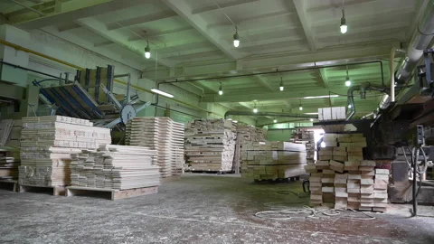 Wooden board stacks and processing equipment in warehouse Stock Footage 141118744