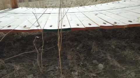 Wooden Boardwalk Path with Log Posts and Chain Railings Видео 333618504
