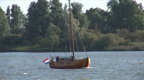 Wooden boat in dutch river Stock Footage