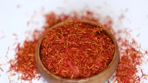 Wooden bowl of saffron rotates around itself. saffron thread in the wooden plate Stock Footage