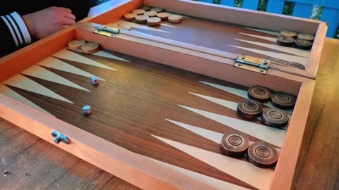 A wooden box with a game of backgammon inside Stock Footage 331258362