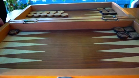 A wooden box with a game of backgammon inside Stock Footage 331357298