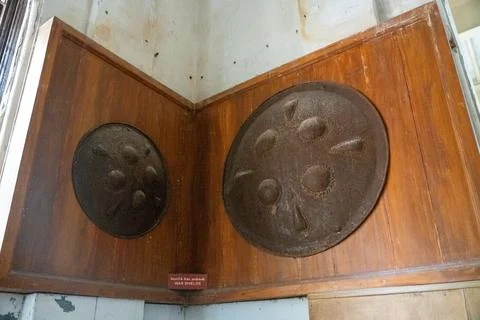 A wooden box with two round objects inside. in Chennai Stock Photos