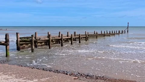 Wooden breakers on the beach Video stock 310574171