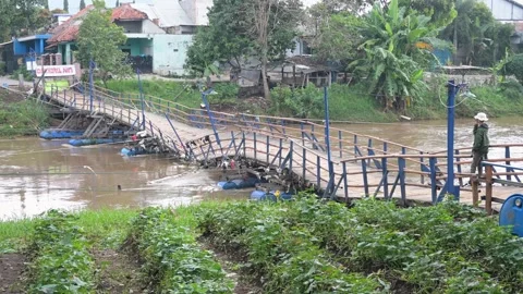 Wooden bridge collapsed at floating bridge Cijeruk, Bandung, Indonesia. Stock Footage 310026707