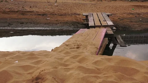 Wooden bridge on the empty abandoned beach Stock Footage 100394289