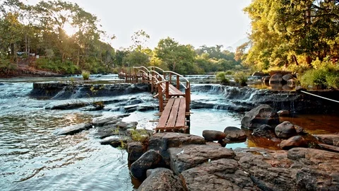 Wooden bridge over the stream Stock Footage 100963099