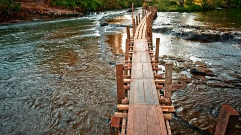 Wooden bridge over the stream Stock Footage 100963182