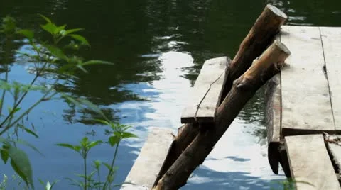 Wooden bridge on the river Stock Footage