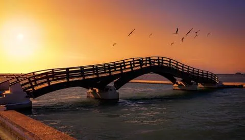 Wooden bridge at sunset Stock Photos