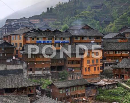 Wooden building rural hotels in Chinese village of ethnic minorities. Stock Photos