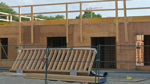 Wooden building under construction with exposed framing, Penticton BC Stock Footage 346869493