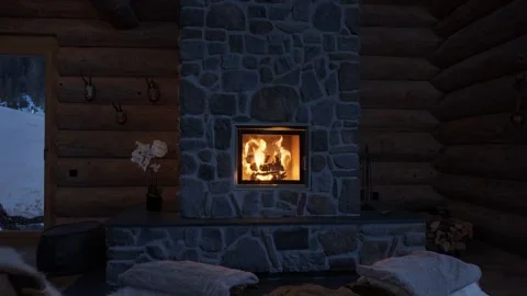 Wooden cabin interior with a warm fire burning in a modern stone fireplace Stock-Footage 335786183