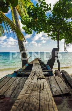 Wooden Canoe and Sea Stock Photos