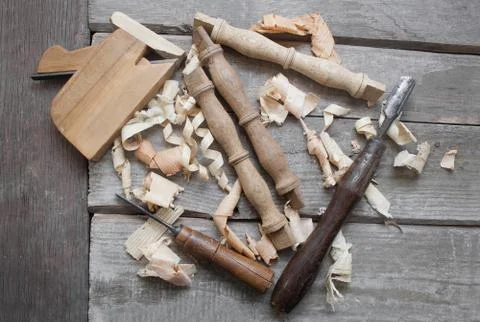 Wooden carpenter table carved elements with instruments. Stock Photos