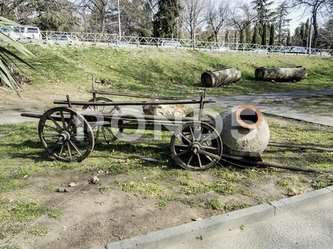 Wooden cart and a pitcher for the transport of wine in Georgia Stock Photos