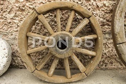 Wooden cart wheel Stock Photos