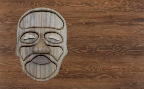 Wooden casket in the shape of a human face. Stock Photos