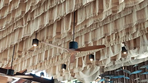 Wooden ceiling fan, with a wave-patterned ceiling. Stock Footage 304472531