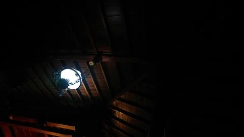 Wooden Ceiling Structure with Hanging Light in Traditional Architecture Stock Photos