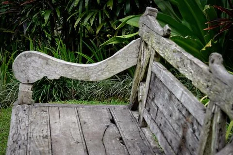 Wooden Chair located in a Balinese Garden Stock Photos