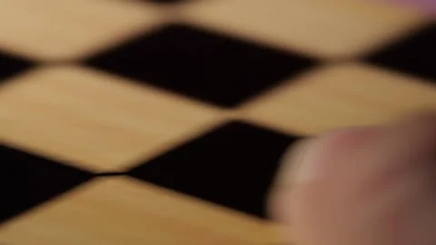 Wooden chess box shaking side side pieces rattling inside close up hand motion Stock Footage 320897854