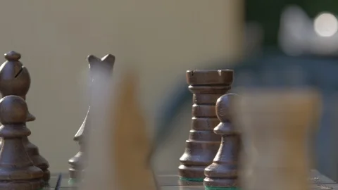Wooden chess game on a table in a camera slide from right to left. Stock Footage 118716353
