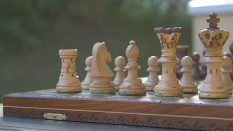 Wooden chess game on a table in a camera slide from left to right. Stock Footage 118719109