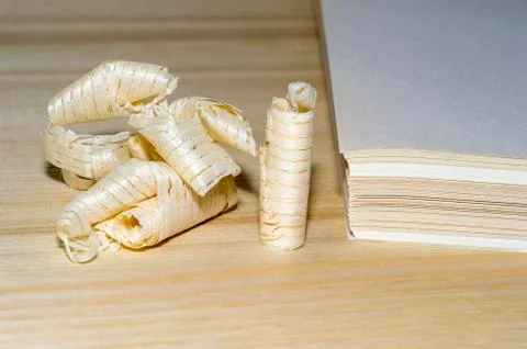 Wooden chips on the background of a stack of paper sheets. The concept of rec Stock Photos