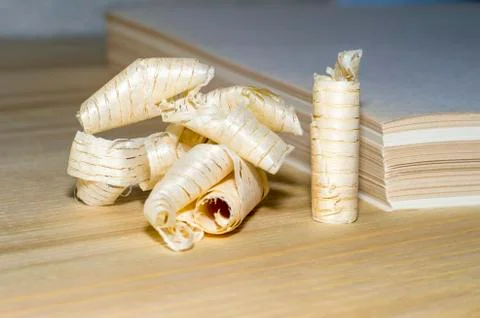 Wooden chips on the background of a stack of paper sheets. The concept of rec Stock Photos