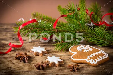Wooden christmas background with gingerbread cookies Stock Photos