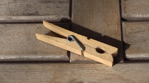 Wooden clothespin in the table Stock Footage 106179096