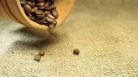 Wooden container with coffee falling on the bag Stock Footage 103097166