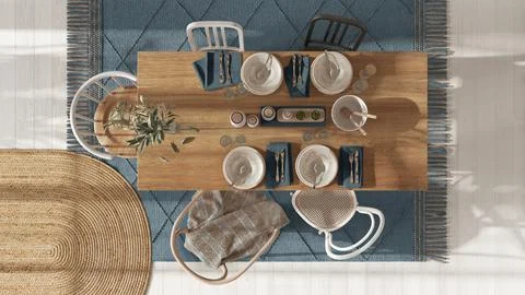 Wooden country dining table with table setting in white and blue tones.Jute c Stock Illustration