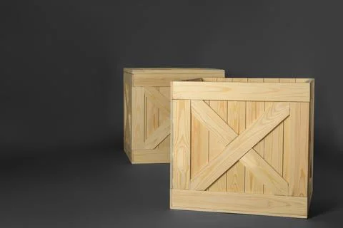 Wooden crates on dark background, space for text. Shipping containers Stock Photos