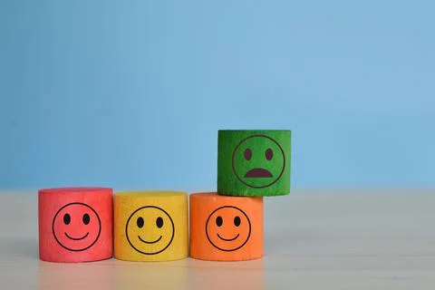 Wooden cube block with different face expression. Customer feedback and evalu Stock Photos