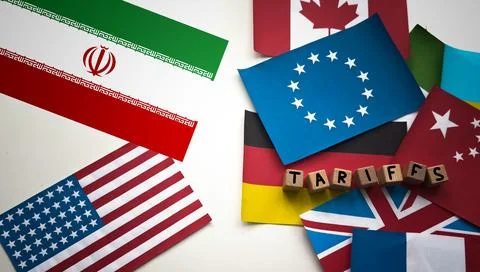 Wooden cube block for tariffs on flags of different countries Stock Photos