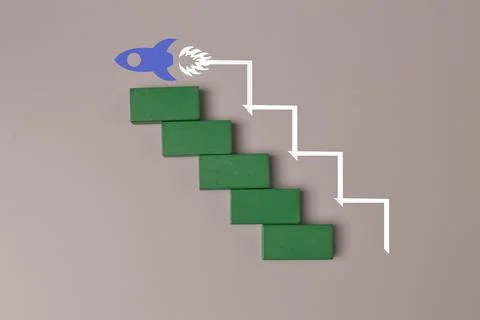 Wooden cube blocks with launching rocket. Business start up, new idea and new Stock Photos