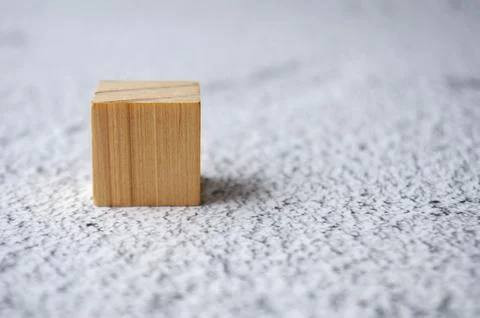 A wooden cube with customizable space for text. Copy space concept Stock Photos