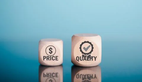 Wooden cube is placed on the table displaying a message of quality assuranc.. Stock Photos