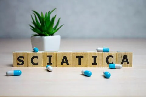 Wooden cube with text Sciatica. Medical concept. background 스톡 사진